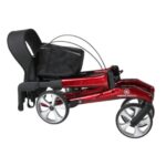 Dubbel opgevouwen rode lichtgewicht rollator